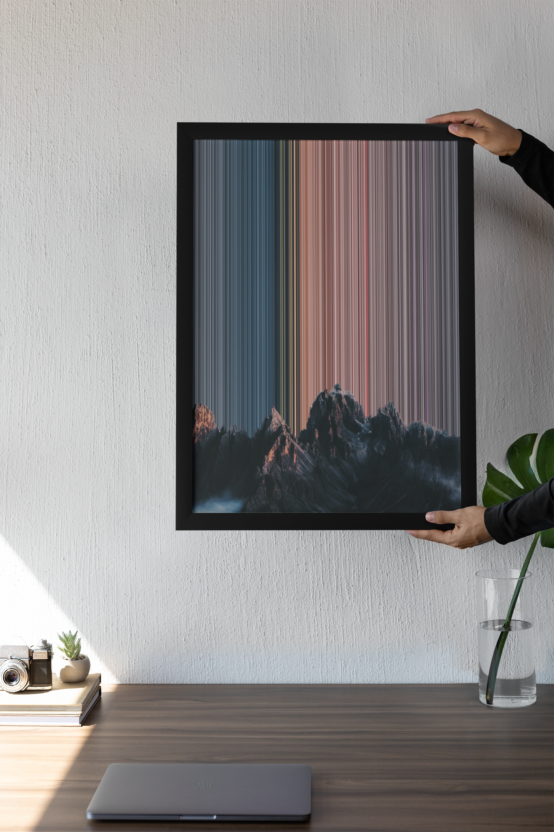 mockup-of-a-person-holding-an-art-print-against-a-wall-m31567.png